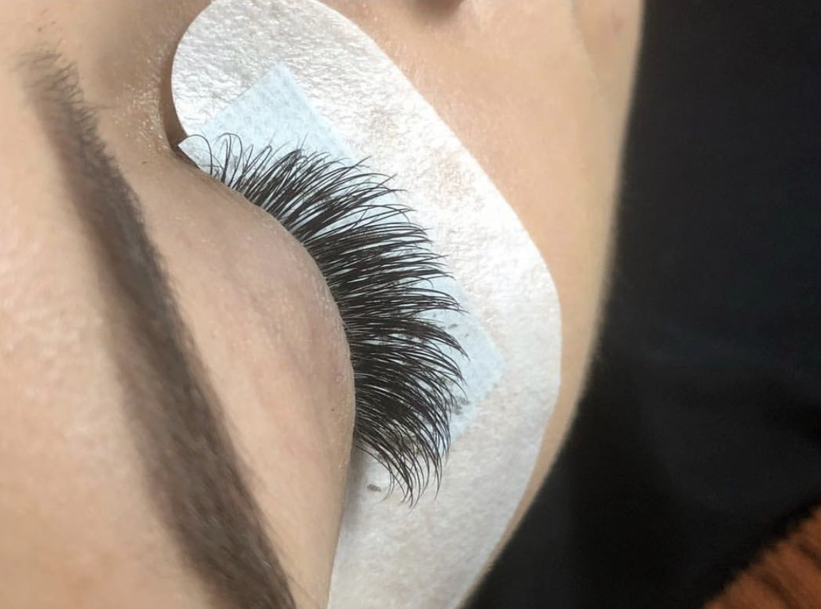 Patient receiving an eyelash lift and tint service.